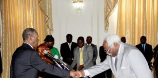 Ambassador Mumba Kapumpa who has been sent to South Korea, shakes hands with President Sata