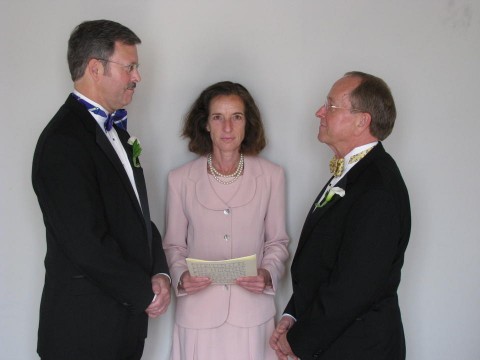 FILE - In this photo released by the Episcopal Dioceses of New Hampshire, Mark Andrew, left, and Bishop V. Gene Robinson are shown during their private civil union ceremony performed by Ronna Wise in Concord, N.H