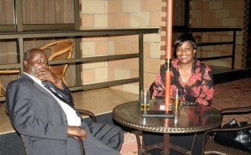Lameck Mangani having a drink with former Lands Minister Judith kapijimpanga - Photo Credit - thepicturemonger