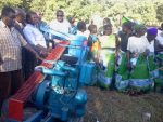 Mr. Yaluma handing over the donated Hammer mill to a women club in Malole Constituecny