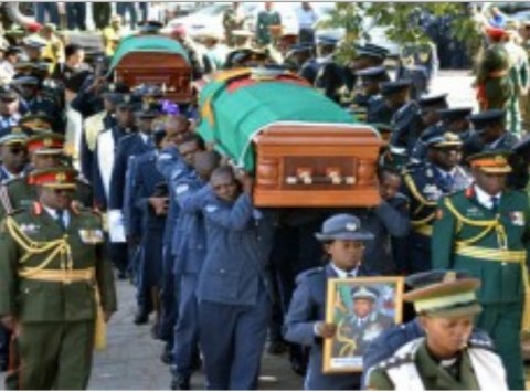 PALLBEARERS arrive with the caskets for the late Zambia Air Force Deputy Commander Major General Muliokela Muliokela and Commanding Officer Colonel Brian Mweene at the Cathedral of the Holy Cross in Lusaka yesterday. Pictures by STEPHEN KAPAMBWE