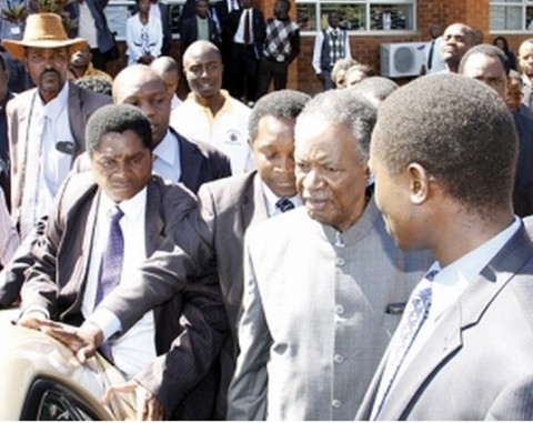 PRESIDENT Sata (second from right) leaving the High Court in Lusaka yesterday. – Picture by MACKSON WASAMUNU.