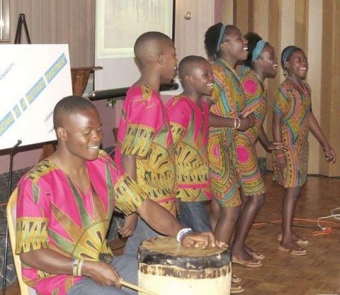 Performing various songs they've learned in class, Eustis, left, Eric, Frederick, Bertha, Dinas and Vivian, school children from Kitwe, Zambia, enjoy showcasing what they've learned.