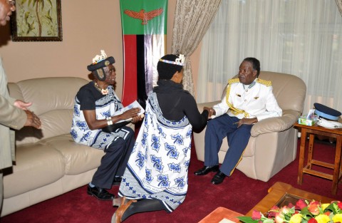 President Sata being greeted by Chief Mukuni's wife as chief Mukuni looks on after the ZAF commissioning Parade in Livingstone on May 9,2014 -Picture by THOMAS NSAMA