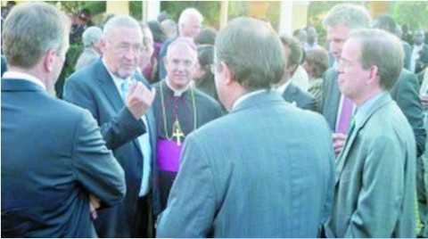 VICE-President Guy Scott (second from left) explains a point to diplomats as Apostolic Nuncio Archbishop Julio Murat (third from left) listens during the first anniversary of the election of Pope Francis in Lusaka on Wednesday. Picture by CHUSA SICHONE