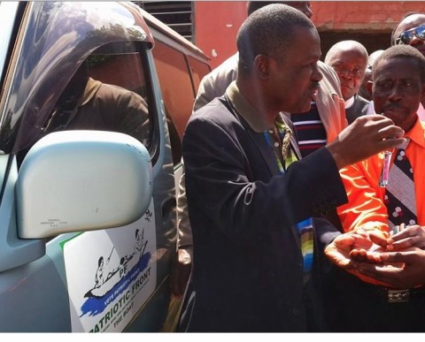 Wynter M. Kabimba  hands over two minibuses donated to the PF in Northern Province to enhance their mobilisation work.