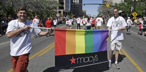 In this June 8, 2014, photo, workers carry a Macy's banner during the gay pride parade, in Salt Lake City. (AP Photo:Rick Bowmer)