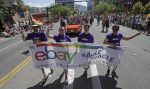 In this June 8, 2014, photo, workers carry an eBay banner during the gay pride parade, in Salt Lake City. . (AP Photo:Rick Bowmer)
