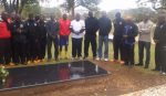 NKANA players and officials at the grave of legendary commentator Dennis Liwewe at Lusaka Memorial Park yesterday. - Picture by DIANA MUTAKAFIMBO.