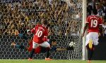 Manchester United’s Wayne Rooney scores from the penalty spot as LA Galaxy goalkeeper Brian Perak attempts a save during their in Pasadena, California on July 23, 2014 (AFP Photo:Frederic J Brown)