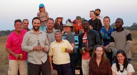 Teachers- Mr Morgan, left, taught for two years at Lusaka International School in Zambia. He is pictured with other members of staff on a day out in the Zambian bush