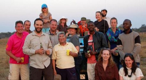 Teachers- Mr Morgan, left, taught for two years at Lusaka International School in Zambia. He is pictured with other members of staff on a day out in the Zambian bush  