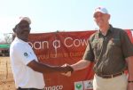 1 ‘Loan a Cow’ beneficiary Chibombo farmer Gillard Shakete shaking hands with ZANACO CEO Bruce Dick