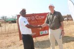 3  ‘Loan a Cow’ beneficiary Chibombo farmer Gillard Shakete shaking hands with ZANACO CEO Bruce Dick