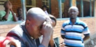 HOLY Fire Christian Ministry Church Bishop Dominic Nyondo shielding his face from cameras at the Kitwe magistrate’s court after he appeared for defilement yesterday. Picture by MOFFAT CHAZINGWA.