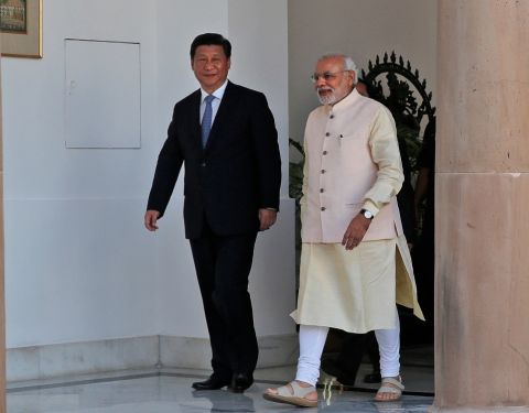 Indian Prime Minister Narendra Modi and visiting Chinese President Xi Jinping walk for a meeting in New Delhi, India, Thursday, Sept. 18, 2014. Manish Swarup—AP Indian Prime Minister Narendra Modi and visiting Chinese President Xi Jinping walk for a meeting in New Delhi, India, Thursday, Sept. 18, 2014. Manish Swarup—AP