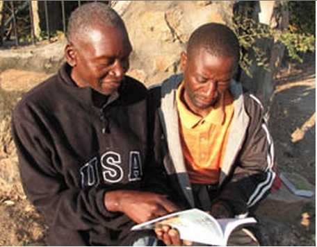 MB photo by James Langston Passmore Hacaba, who has endured persecution for his faith, discusses a Bible verse with Tonga believer Maxwell Mwaanga. MB photo by James Langston Passmore Hacaba, who has endured persecution for his faith, discusses a Bible verse with Tonga believer Maxwell Mwaanga.