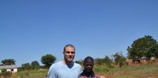 Mickey Kinzenbaw with Zambian resident Chimbaza Mbewe, who was trained by members of the Ankeny Free Church to grow his own crops. (Photo: Mickey Kinzenbaw/Special to the Register )