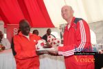 Ministry of Education and Early Childhood  PS Dr Patrick Nkanza receiving from Zanaco MD Dick Bruce some soccer balls meant to selected Lusaka based primary schools ,the ceremony took place at the ZANACO Sunset Stadium