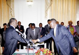 President Sata congratulates new Supreme Court Judge Mumba Malila during the swearing-in-ceremony at State House on September 1,2014 -Picture by THOMAS NSAMA