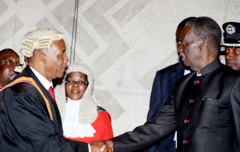 President Sata greets deputy speaker of the Natiional Assembly Mkhondo Lungu during the opening of parliament on September 19, 2014 -Picture by THOMAS NSAMA