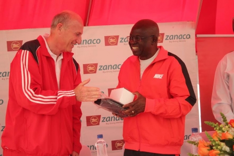 Zanaco MD Dick Bruce congratulating  the PS Dr. Patrick Nkanza voted the best player