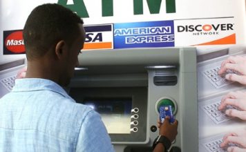 A Somali man uses the first-ever cash machine in Mogadishu. Photograph: Abdulfitah Hashi Nor/AFP/Getty Images