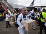 Cuban doctors and health workers arrive at Freetown's airport to help the fight against Ebola in Sierra Leone. Photograph: Florian Plaucheur/AFP/Getty Images