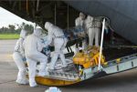 Medics load an Ebola patient onto a plane at Sierra Leone’s Freetown-Lungi International Airport on Monday, September 22.