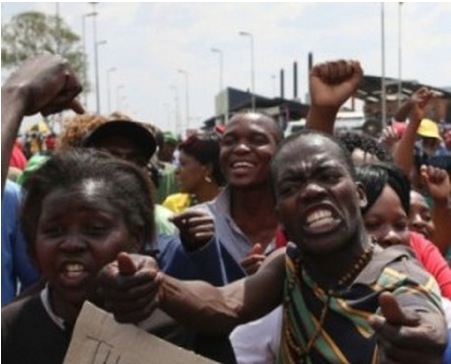 South Africans riot as fifth man arrested over rape and murder of girls in shantytown