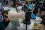 The team prepares to clean up after removing the bodies – Ebola crisis in Liberia