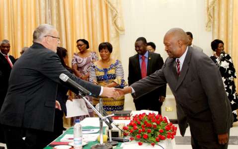 Acting President Dr Guy Scott congratulates Justice Lishomwa Nawa Muuka during the swearing -in-ceremony of four High Court Judges on November 25,2014 -Picture by THOMAS NSAMA
