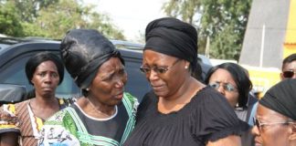 First Lady Dr Christine Kaseba being comforted by Gender minister Inonge Wina (l) on arrival at Lusaka Show grounds for the gathering to Celebrate President Sata's life on Nov 6,2014 -Picture by THOMAS NSAMA