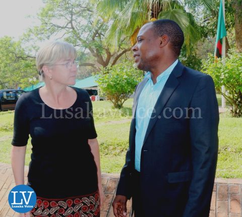 FAZ President Kalusha Bwalya; FAZ spokesperson Nkweto Tembwe sign book for Sata
