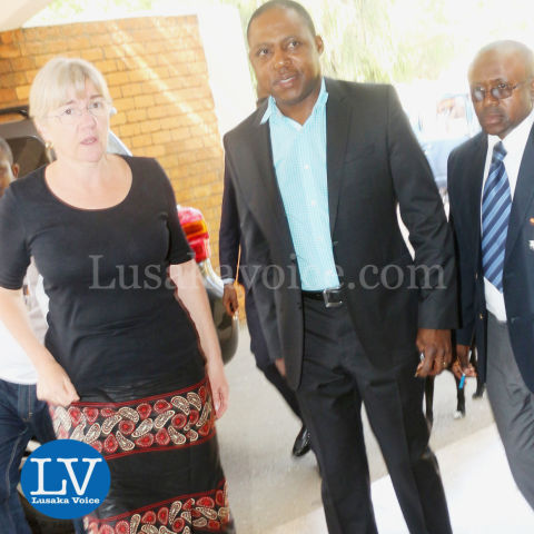 FAZ President Kalusha Bwalya; FAZ spokesperson Nkweto Tembwe sign book for Sata