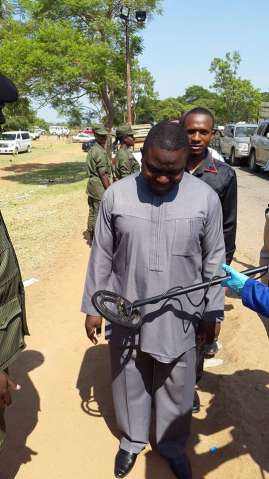 Security check is thorough. Here Minister of Foreign Affairs, Harry Kalaba goes through metal detectors.
