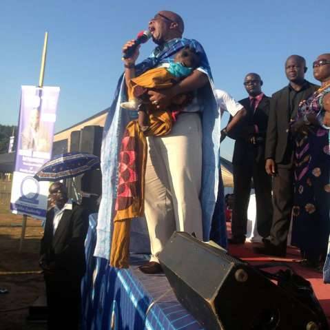 Dr Mumba with a baby whose family house was demolished by local authorities in Ndola on the day of her birth.