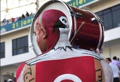 A fan of Tunisia's Carthage Eagles bangs the drum for the 2004 champions, whose Nations Cup would end in the quarter-finals at the hands of Ghana