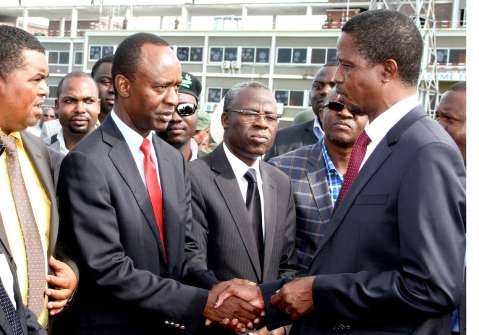 President Lungu greets State House deputy minister Mulenga Sata shortly before departure at Kenneth Kaunda International Airport for Angola on February 13,2015 -Picture by THOMAS NSAMA