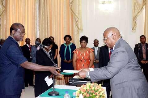 Acting President Ngosa Simbyakula receives an affidavit of Oath from Ministry of Finance Permanent Secretary Dr Ronald Simwinga during the Swearing-In-Ceremony at State House on March 13,2015 -Picture by THOMAS NSAMA