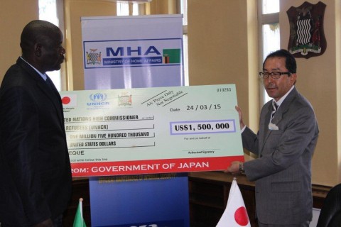 Japanese Ambassador to Zambia, Koishi Koinuma, presenting a US$1.5 million cheque to Home Affairs Minister, Davis Mwila in Lusaka, Zambia on Tuesday 24 March 2015. The funds will go towards the refugee and local integration programme in Zambia. Picture courtesy of UNHCR Japanese Ambassador to Zambia, Koishi Koinuma, presenting a US$1.5 million cheque to Home Affairs Minister, Davis Mwila in Lusaka, Zambia on Tuesday 24 March 2015. The funds will go towards the refugee and local integration programme in Zambia. Picture courtesy of UNHCR