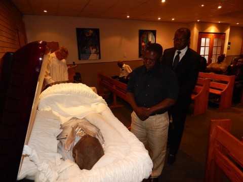 PF memeber of the Central Committee, Mr. Samuel Mukupa, pays his last respects