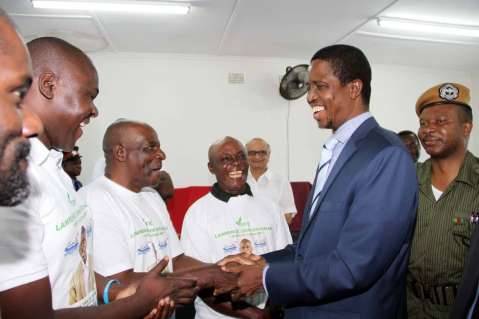 President Edgar Chagwa Lungu congratulates Chawama constituency PF parliamentary candidate Lawrence Chalwe at Chawama Basic school on March 10,2015   Chawama Constituency