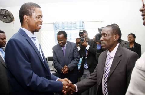 President Edgar Chagwa Lungu congratulates Chawama constituency PF parliamentary candidate Lawrence Chalwe at Chawama Basic school on March 10,2015, where the President witnessed the filling in of nomination papers of Chawama Constituency