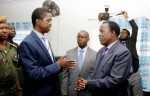 President Edgar Chagwa Lungu speaks with ECZ Commissioner Judge Chulu at Chawama Basic school on March 10,2015, where he witnessed the filling in of nomination papers of Chawama Constituency PF Parliamentary Candidate Lawrence Sichalwe