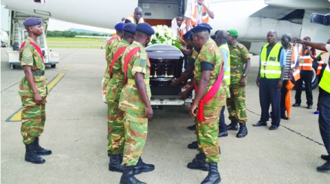 ZAMBIA Army pallbearers prepare to lift late Willie Nsanda’s casket from a South African Airways plane at Simon Mwansa Kapwepwe International Airport in Ndola yesterday. Picture by JAMES KUNDA