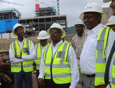 in the middle wearing glasses- ZESCO acting MD Victor Mundende
