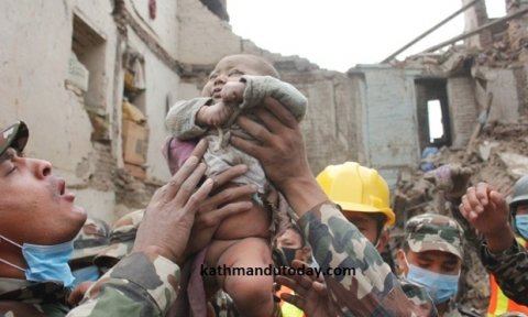 A baby boy was recovered alive from a collapsed building. Photograph: Kathmandu Today