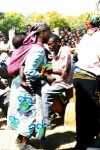 A baby on the back of a woman who was dancing the Chiwoda at the Lundazi Agricultural Show in 1996. Zambian babies experience a lot of excitement and may be that’s why they don’t cry.