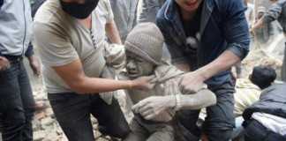 A man is freed from a collapsed building in Kathmandu on Saturday, April 25 following